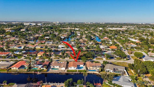 birds eye view of property with a water view and a residential view