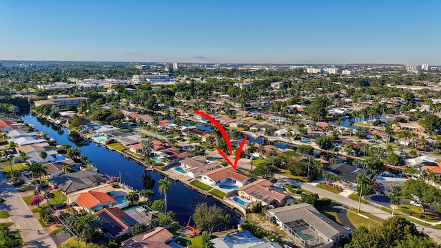 birds eye view of property featuring a water view and a residential view