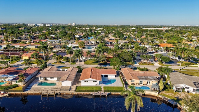 birds eye view of property with a water view and a residential view