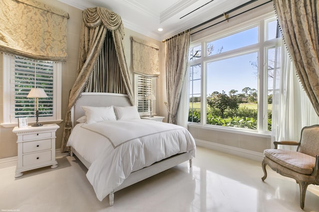 bedroom with baseboards, multiple windows, and ornamental molding