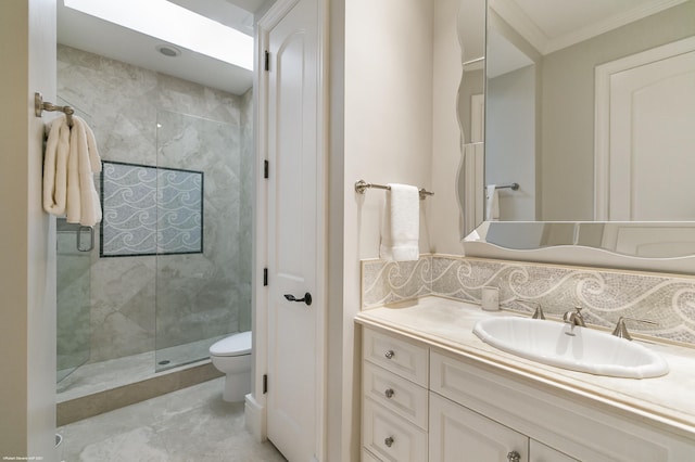 full bath featuring backsplash, toilet, ornamental molding, a shower stall, and vanity