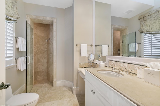 full bath with visible vents, baseboards, toilet, vanity, and a shower stall