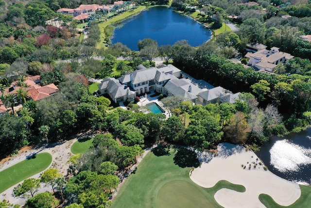 birds eye view of property featuring view of golf course and a water view