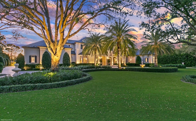 view of front of home with a yard