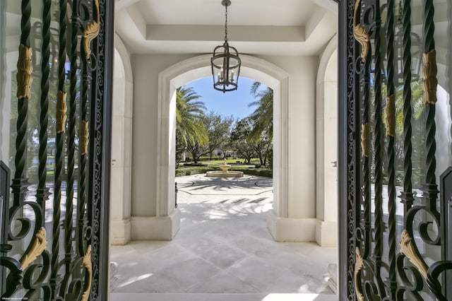 foyer entrance featuring a raised ceiling