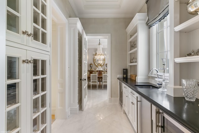 bar featuring light tile patterned floors, ornamental molding, a sink, and an inviting chandelier