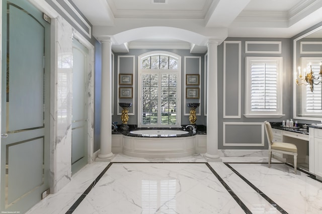 bathroom with marble finish floor, ornamental molding, a bath, and ornate columns