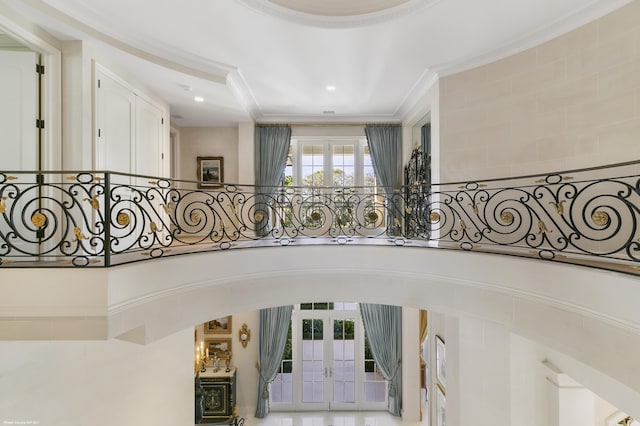 staircase with recessed lighting, arched walkways, crown molding, and french doors