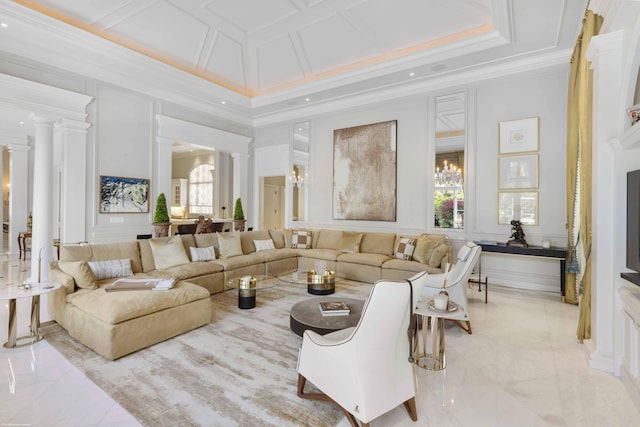 living area with crown molding, decorative columns, and a decorative wall