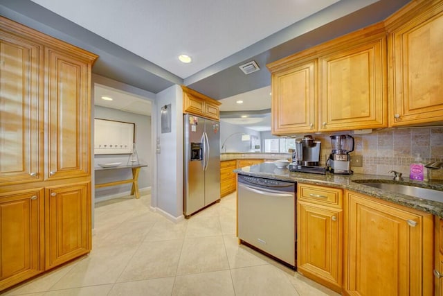 kitchen featuring light tile patterned floors, visible vents, backsplash, appliances with stainless steel finishes, and dark stone counters