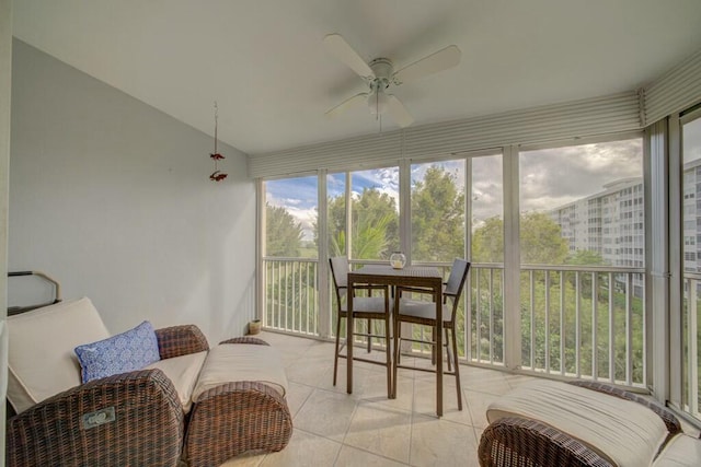 sunroom / solarium featuring vaulted ceiling and a ceiling fan