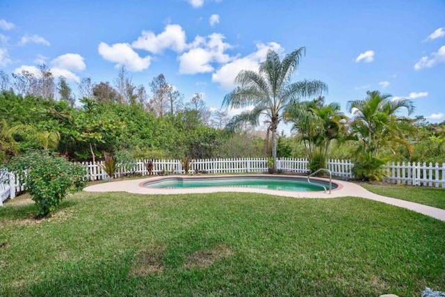 view of pool with a fenced backyard, a fenced in pool, and a yard