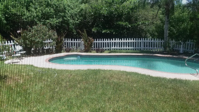 view of swimming pool with a fenced in pool