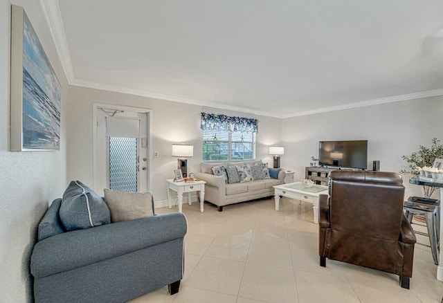 living room with light tile patterned floors, ornamental molding, and baseboards