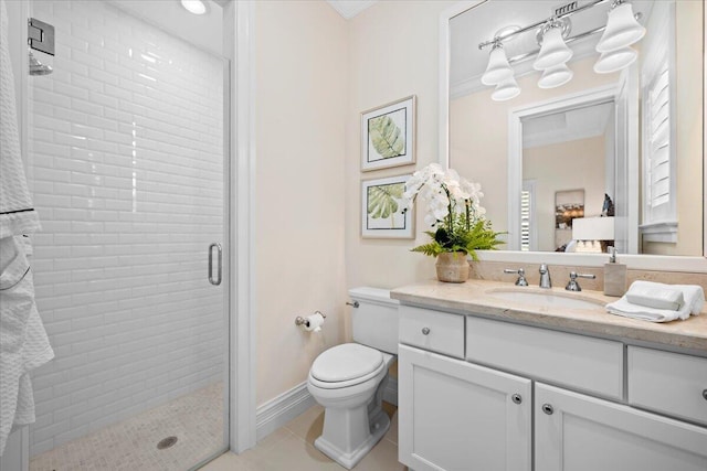 bathroom with crown molding, toilet, vanity, a shower stall, and tile patterned floors