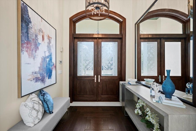 entryway featuring a chandelier