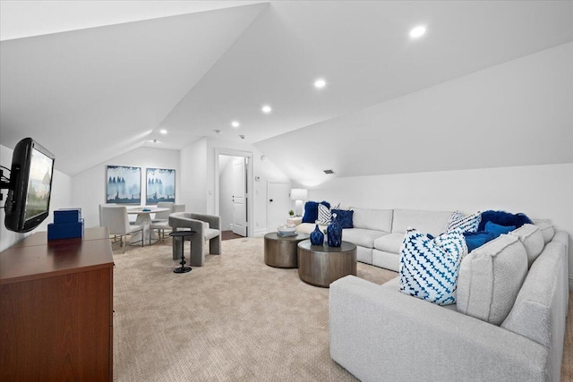 living area with vaulted ceiling, recessed lighting, and carpet floors