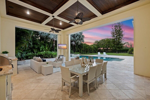 view of patio featuring outdoor dining space, an outdoor pool, ceiling fan, and an outdoor living space with a fireplace