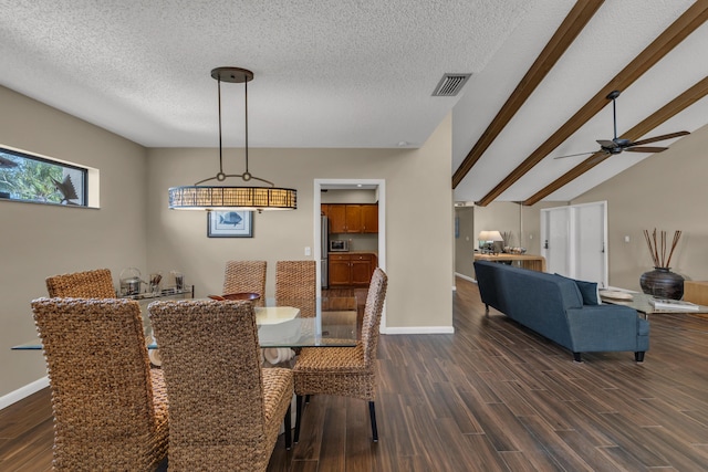 dining room featuring dark wood-style floors, lofted ceiling with beams, visible vents, and baseboards