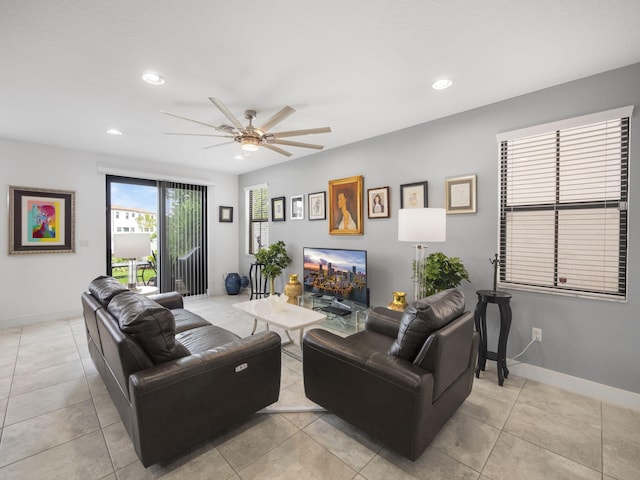 living room with ceiling fan, recessed lighting, baseboards, and light tile patterned floors