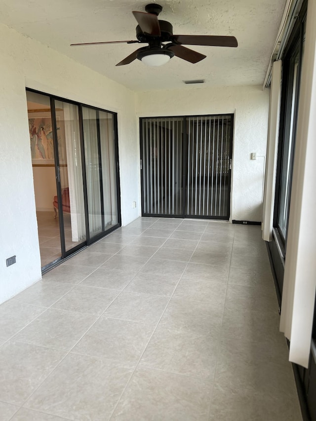 10694 Ocean Palm Way Unit 202, Boynton Beach, FL 33437 - unfurnished room with a ceiling fan and tile patterned floors