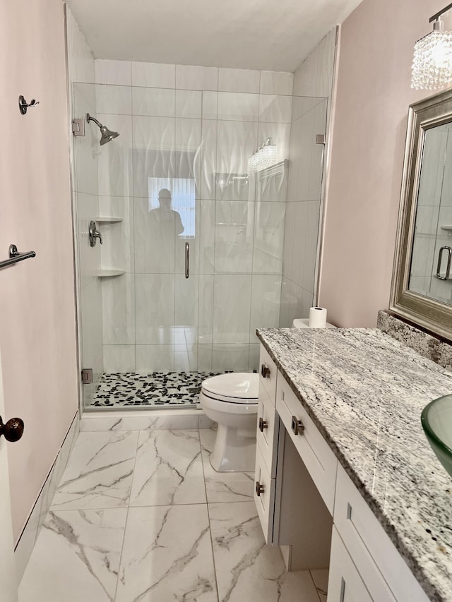 10694 Ocean Palm Way Unit 202, Boynton Beach, FL 33437 - bathroom with marble finish flooring, a stall shower, toilet, and vanity