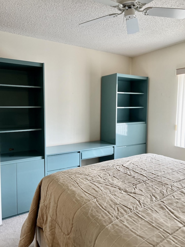 10694 Ocean Palm Way Unit 202, Boynton Beach, FL 33437 - carpeted bedroom with a textured ceiling and ceiling fan