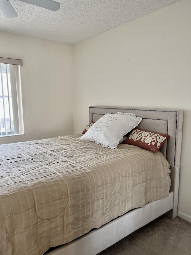 10694 Ocean Palm Way Unit 202, Boynton Beach, FL 33437 - carpeted bedroom featuring a textured ceiling and ceiling fan