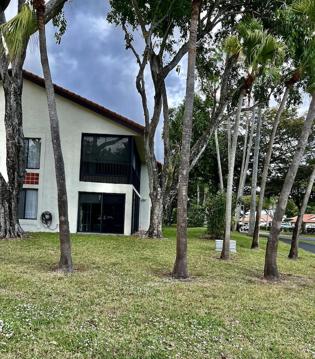 10694 Ocean Palm Way Unit 202, Boynton Beach, FL 33437 - view of grassy yard