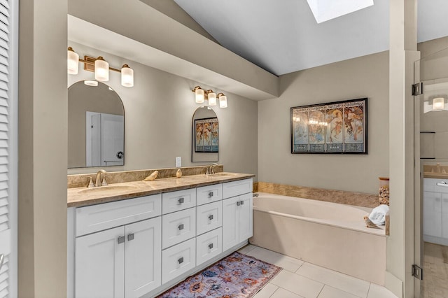 full bath featuring tile patterned flooring, a sink, a bath, and double vanity