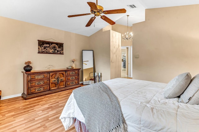 bedroom with ceiling fan with notable chandelier, visible vents, baseboards, vaulted ceiling, and light wood-style floors