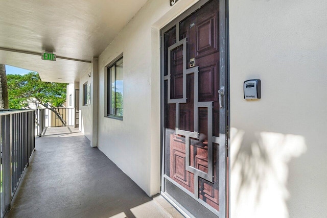 view of exterior entry featuring stucco siding