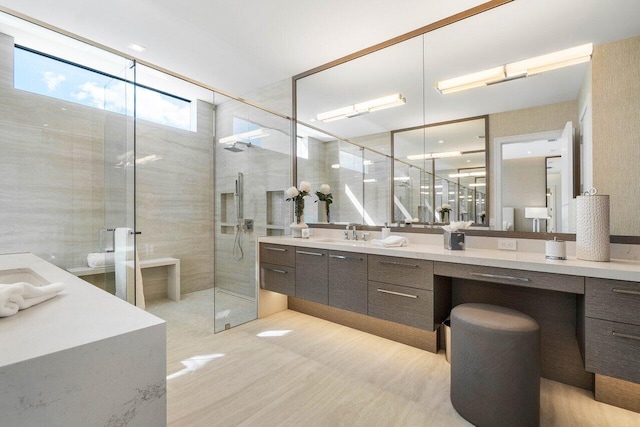 full bath featuring a shower stall and vanity