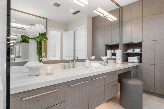 bathroom with visible vents and vanity