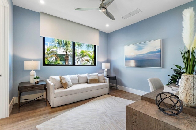 living area featuring baseboards, visible vents, ceiling fan, wood finished floors, and recessed lighting