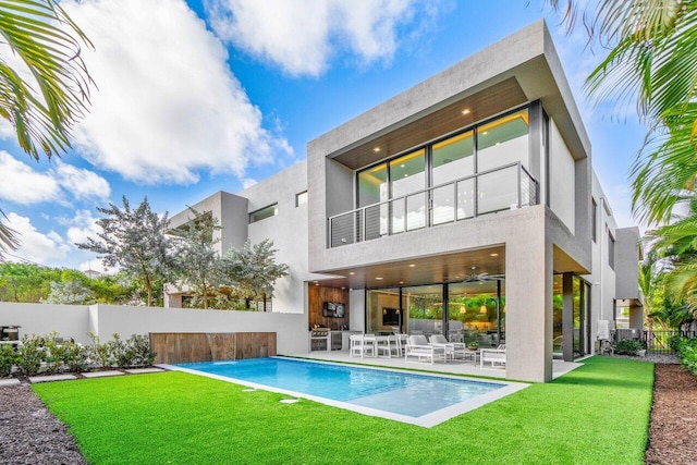 back of property featuring a patio, fence, a balcony, and stucco siding