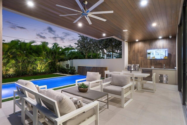 view of swimming pool with a fenced in pool, a ceiling fan, a patio, area for grilling, and an outdoor hangout area