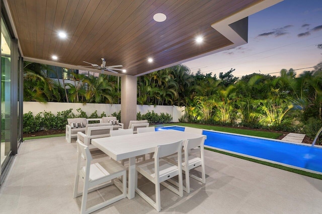 view of pool featuring a fenced in pool, outdoor dining area, a patio, an outdoor hangout area, and a ceiling fan