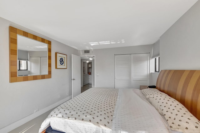 bedroom featuring visible vents and a closet