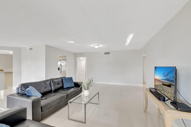 living room featuring visible vents and baseboards