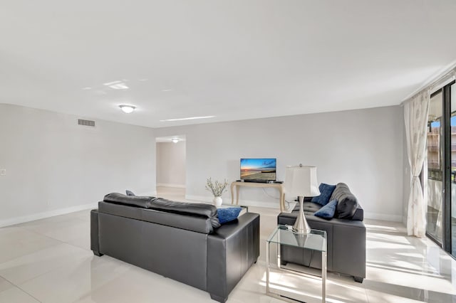 living area with visible vents and baseboards