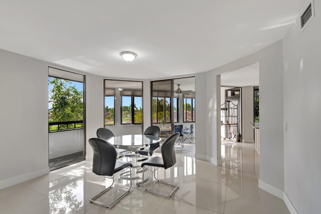 dining room featuring visible vents and baseboards