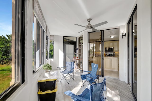 sunroom / solarium with ceiling fan