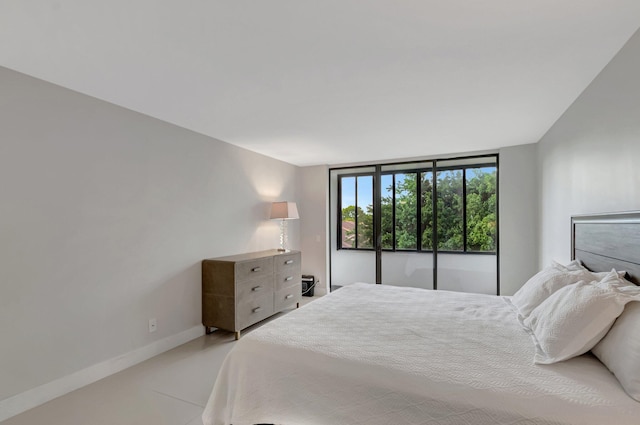 bedroom featuring baseboards