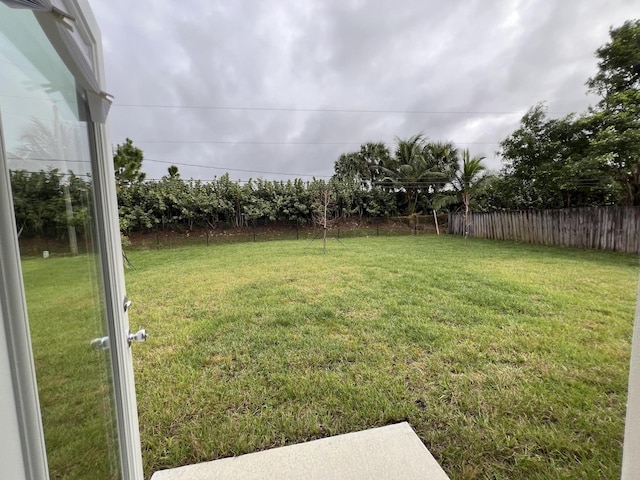 view of yard with fence