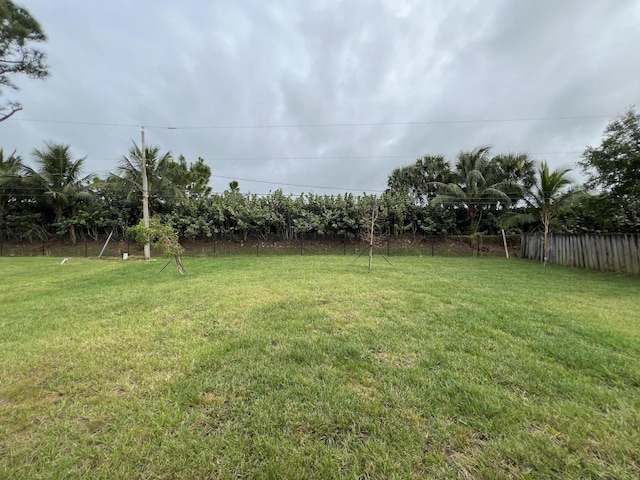 view of yard with fence