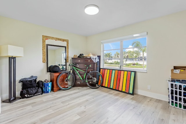 interior space with light wood-style floors and baseboards