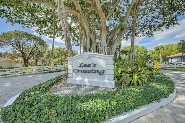 community sign with fence