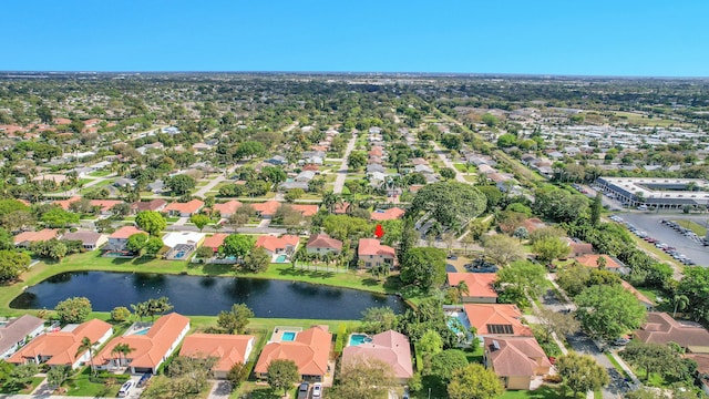 bird's eye view with a water view and a residential view