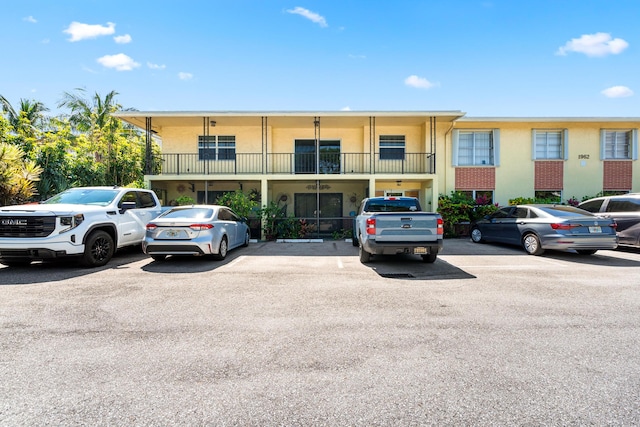 view of property with uncovered parking